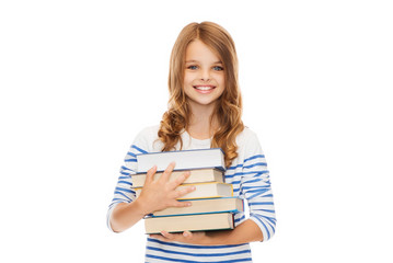 Wall Mural - little student girl with many books