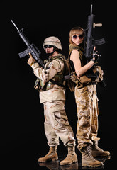 Wall Mural - Beautiful army girl with gun