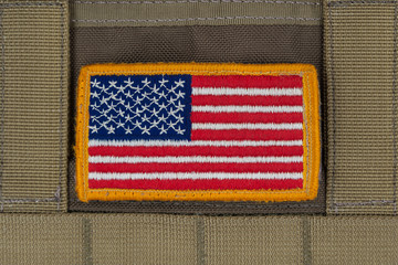 rounded american flag patch on u.s. military combat uniform.