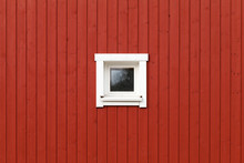 Red Wooden Wall With Small Window In White Frame