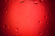water drops on red background with spotlight center