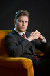 © pfpgroup - Elegant man sitting on an armchair