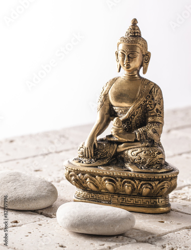 Fotografie, Obraz Buddha for zen attitude with stone background