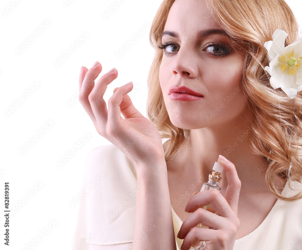 Beautiful young woman with perfume bottle isolate on white