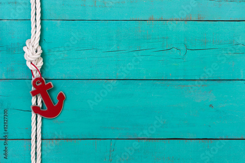 Fotografia Blank nautical sign with rope and red anchor border