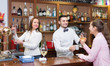 © JackF - Girl flirting with barman at counter