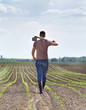© Budimir Jevtic - Farmer with hoe in corn field