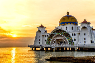 sunset over masjid selat mosque in malacca malaysia