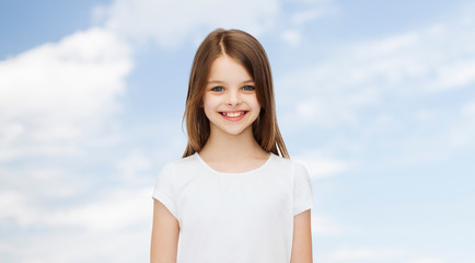 Sticker - smiling little girl in white blank t-shirt