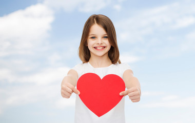 Wall Mural - smiling little girl in white blank t-shirt