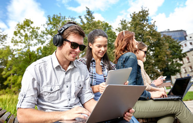 Wall Mural - students or teenagers with laptop computers