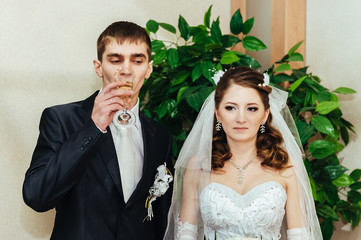 Wedding ceremony. Registry office. A newly-married couple signs