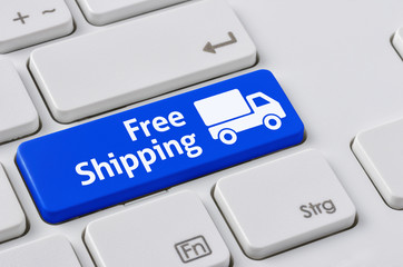 Wall Mural - a keyboard with a blue button - free shipping