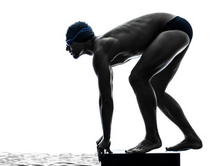 Wall Mural - young man swimmer swimming silhouette