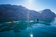 © kuznetsov_konsta - Kayak. People kayaking in the sea near the mountains.