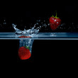 Strawberry falls into water. Strawberries in the air. 