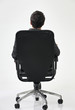 © eskay lim - back view of man on chair