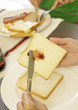 © eskay lim - woman making breakfast