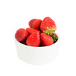 Fresh strawberries in white bowl, isolated over white