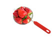 Fresh strawberries in small colander, isolated over white