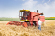 Business people with combine harvester