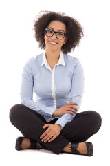 Wall Mural - happy beautiful african american business woman sitting isolated