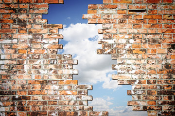 Through a crack of a brick wall you see the sky - concept image