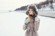 © rohappy - Portrait of a beautiful woman dressed a coat and fur hat in the