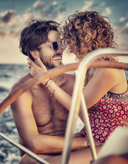 Wall Mural - Loving couple on sailboat