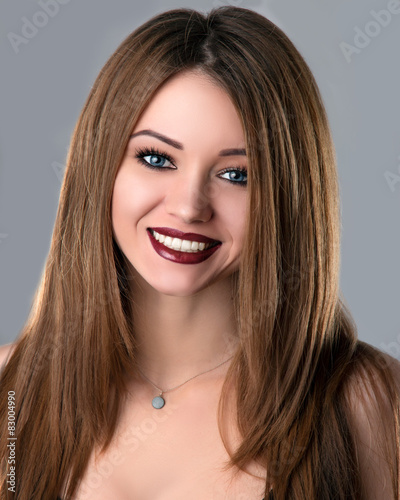 Beautiful Smiling Young Woman With Volume Straight Long Hair