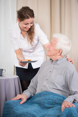 Canvas Print - Caring nurse and older man