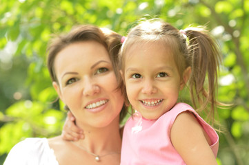 Wall Mural - Little girl with her mother 