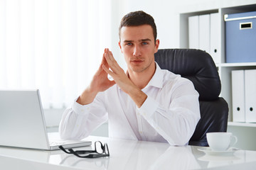 Wall Mural - Business man working in an office with a laptop