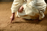 Fototapeta Sport - Jesus Writing on the sand