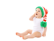 Cute Baby In The Hat Gnome Sitting And Looking Up
