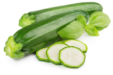 two zucchini and basil leaf isolated on white background