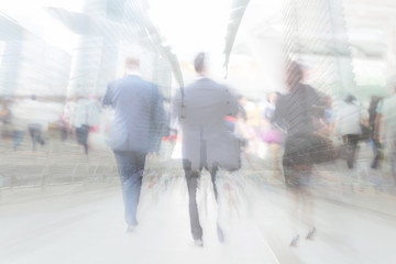 motion blur businesspeople with cityscape background