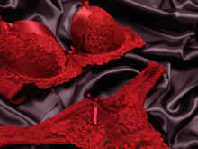 Dark Red Lacy Lingerie On Black Background