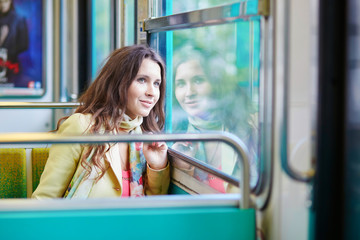 Poster - Young beautiful Parisian woman in subway