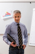 © DenisProduction.com - Business man with a folder in hand.