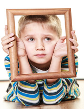Little Sad Boy Child Framing His Face