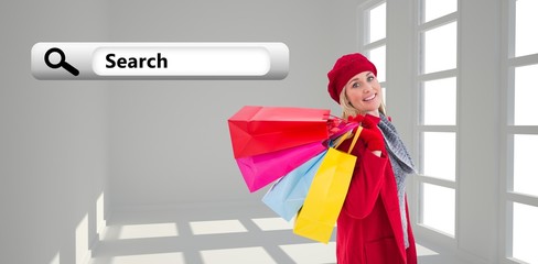 Poster - Blonde in winter clothes holding shopping bag