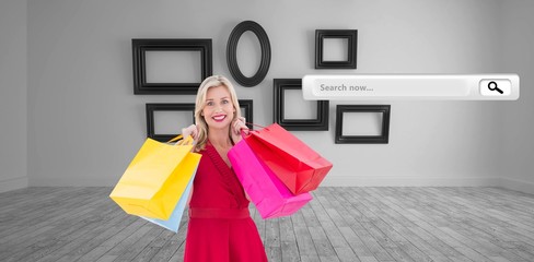 Poster - stylish blonde in red dress holding shopping 