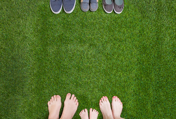 Canvas Print - Family legs  standing  opposite shoes 