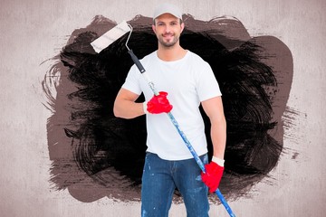 Poster - Composite image of handyman holding paint roller 