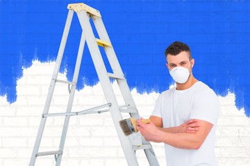 Poster - Composite image of handyman with paintbrush and ladder 