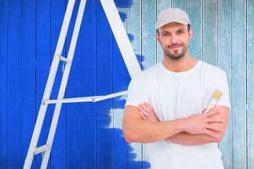 Poster - Composite image of handyman with paintbrush and ladder 