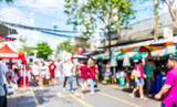 Fototapeta  - Blurred background : people shopping at market fair in sunny day