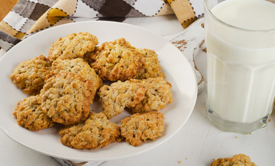 Oatmeal cookies and glass of milk.