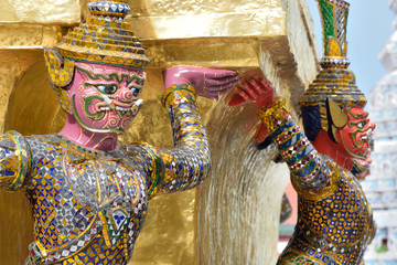 Wall Mural - The Golden Pagoda and Yak statue at the phra kaew